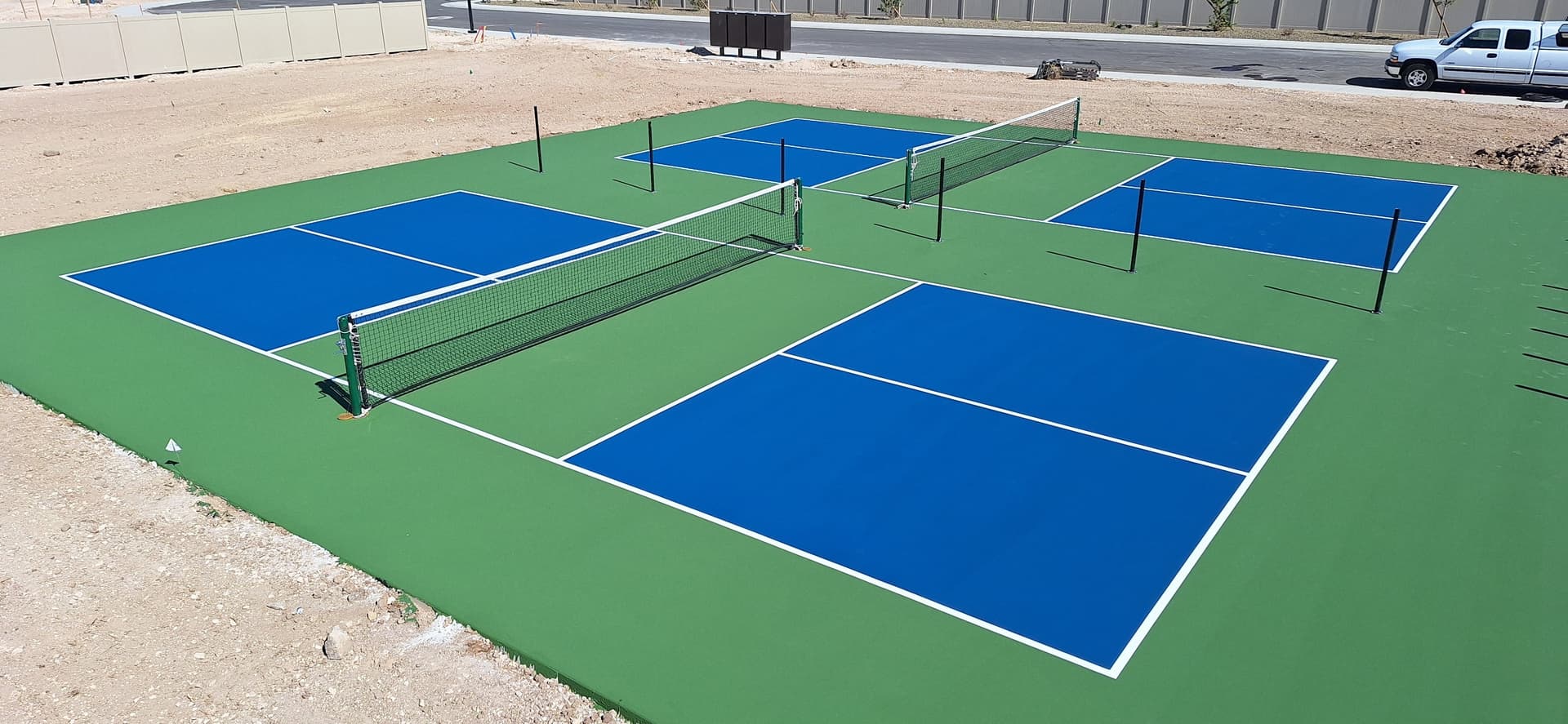 double pickleball court blue green surface