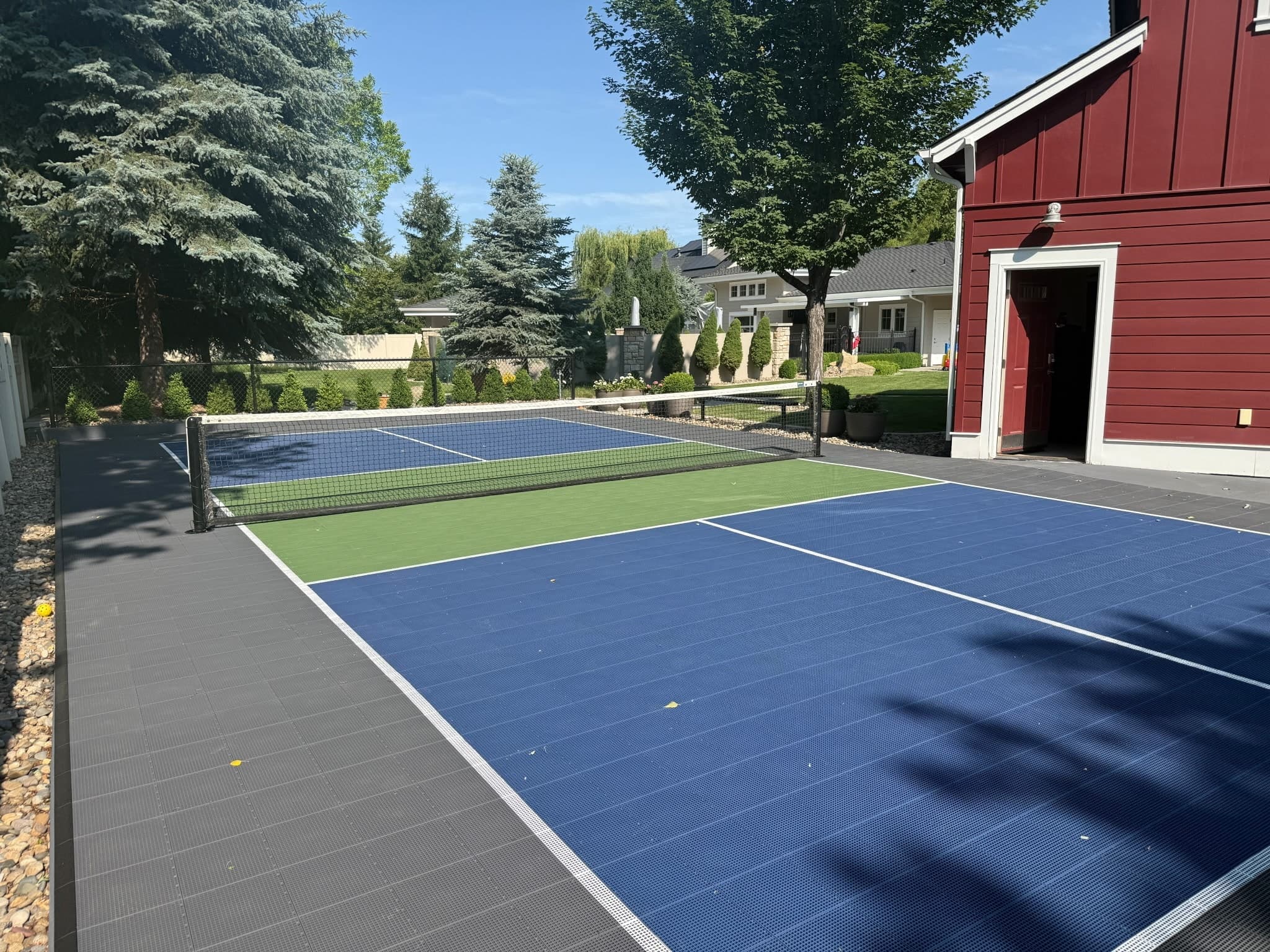 Custom backyard pickleball court construction — Hatz Court Builders